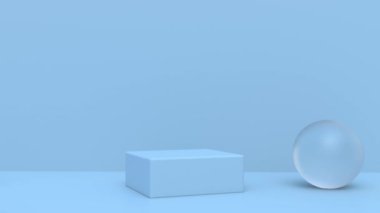 Çerçevenin ortasında dikdörtgen bir kaide. Cam toplar yavaşça ona doğru yuvarlanıyor. Ürün sunumu aşaması