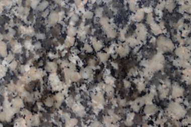 Granit taş arka planda siyah, beyaz ve gri renkte. Kopyalama alanı için alanı olan desen