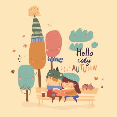 Mutlu çocuklar sonbahar parkında kitap okuyor.