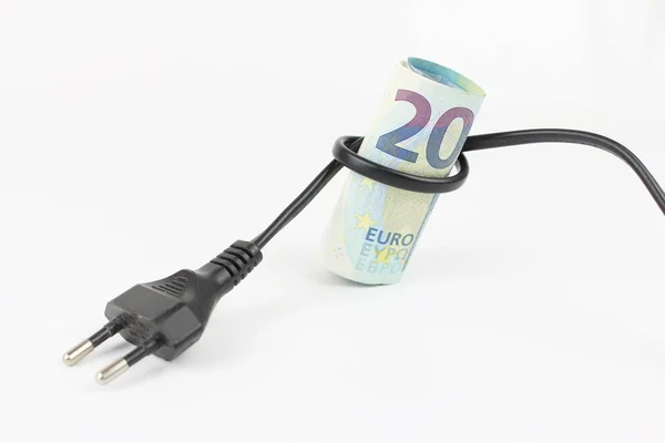 Costs and expenses on the electricity bill, two banknotes from 20 euro each, flush with outlet plug with the node that holds banknotes.