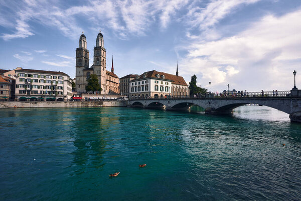 Sights of Zurich over the river with the bridge and ducks
