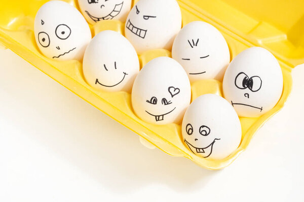 set of funny eggs with painted faces