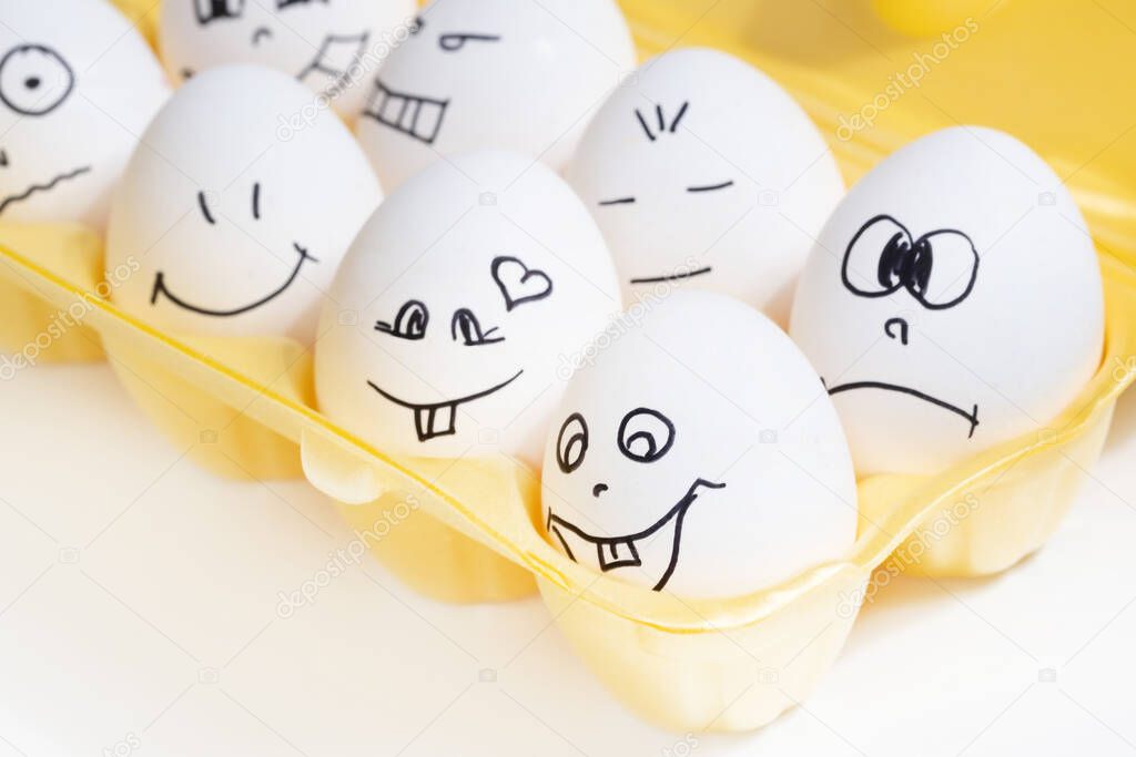 set of funny eggs with painted faces