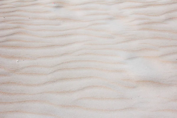 Strand zand textuur en patroon achtergrond — Stockfoto