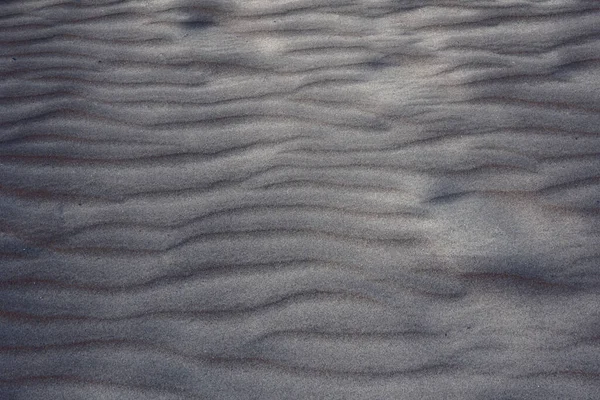 Praia areia textura e padrão de fundo — Fotografia de Stock