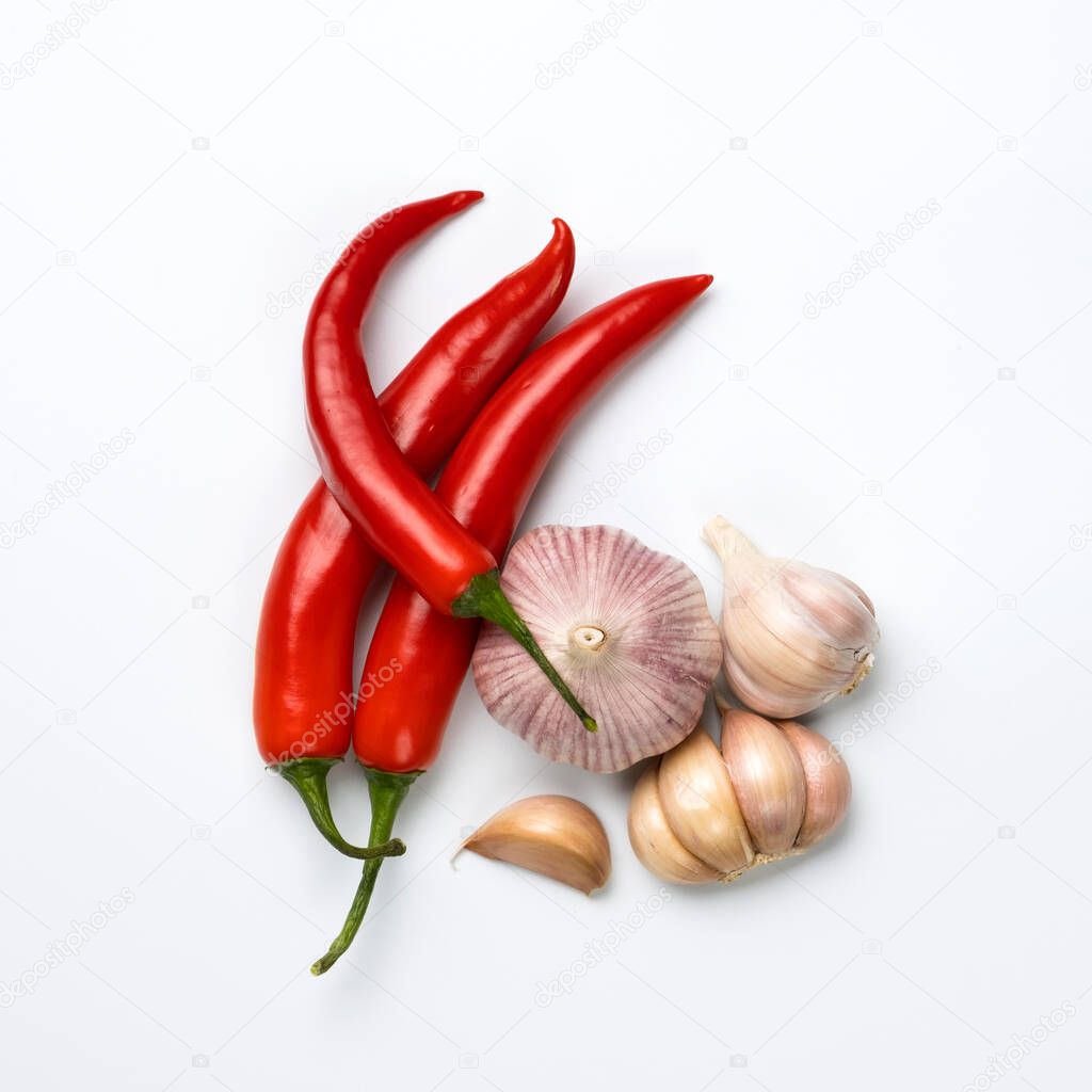Red chili peppers and garlic isolated on white background.
