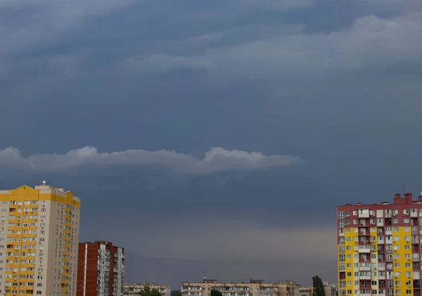 Thunder-Sky under the colored houses in the city, cityscape
