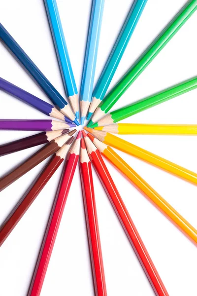 sharpened colored pencils lie in a circle with their noses in the center, school supplies, LGBT symbol