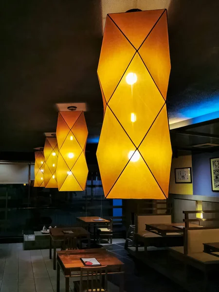 This shot shows a rows of light within the restaurant.