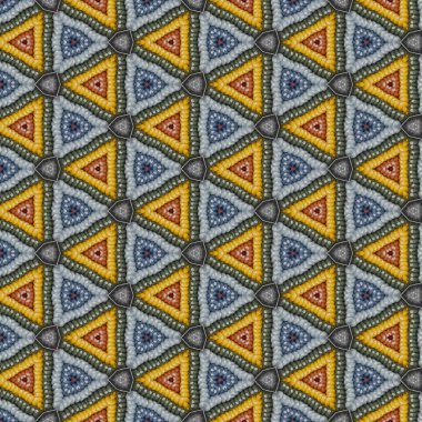 Renkli Kore pirinç kekinden kaynaklanan kaleydoskopik desen. Gri ve sarı üçgenler radyal olarak yayılmış..