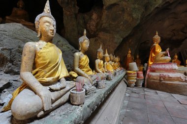 Many of buddha at Khao Luang Cave, Phetchaburi, Thailand clipart