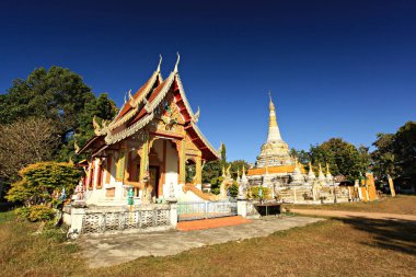 Scenery of Buddhist temple and white pagoda in Wat Luang (Luang Temple) in Pai District, Mae Hong Son Province, Thailand 