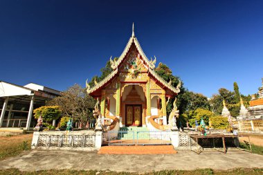 Scenery of Buddhist temple and white pagoda in Wat Luang (Luang Temple) in Pai District, Mae Hong Son Province, Thailand 