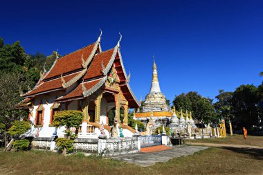 Scenery of Buddhist temple and white pagoda in Wat Luang (Luang Temple) in Pai District, Mae Hong Son Province, Thailand 