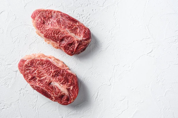 Australia wagyu oyster top blade steak on white background top view space for text.