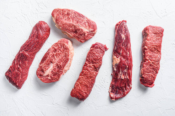 Set of denver, top blade,  tri tip steak, machete, flank, bavette London broil  marble beef on white background top view .