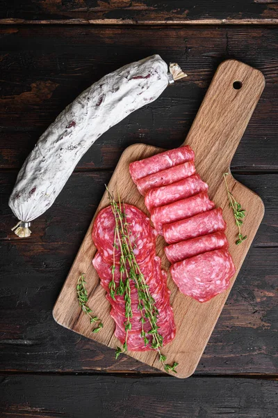 Salchichon Dry Cured Sausages Cut Slices Old Wooden Table Flat — Stock Photo, Image