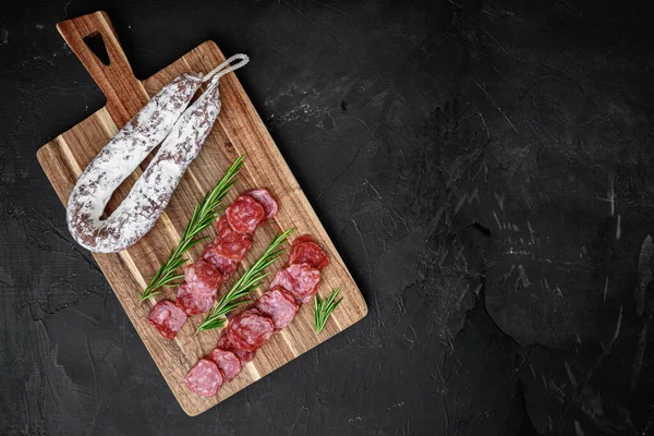 Fuet Salami Wurst Cut Slices Whole Sausage Black Textured Surface — Stock Photo, Image