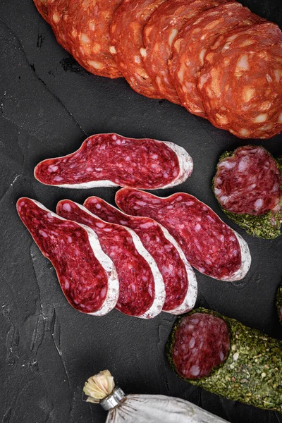 Set Dry Cured Salami Spanish Sausages Slices Cuts Black Background — Stock Photo, Image