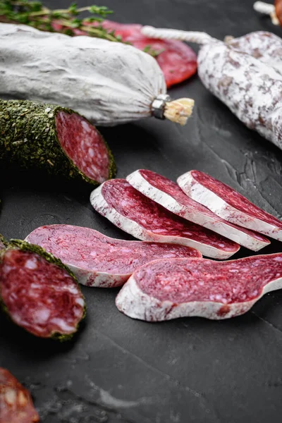 Set Dry Cured Salami Spanish Sausages Slices Cuts Black Background — Stock Photo, Image