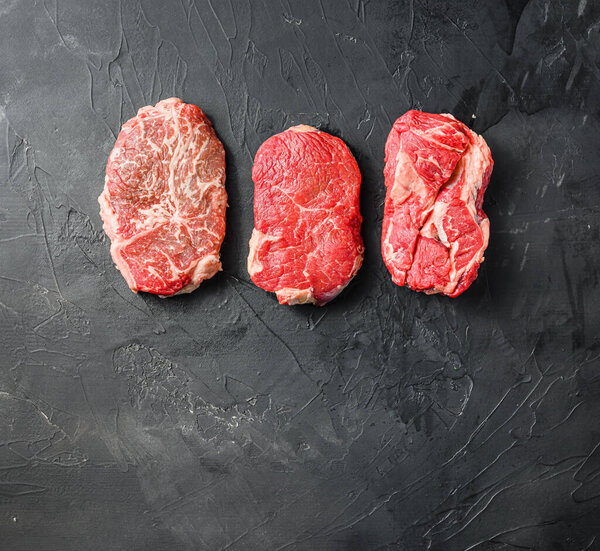 Variety of raw alternative steaksramp and chuck eye roll and top