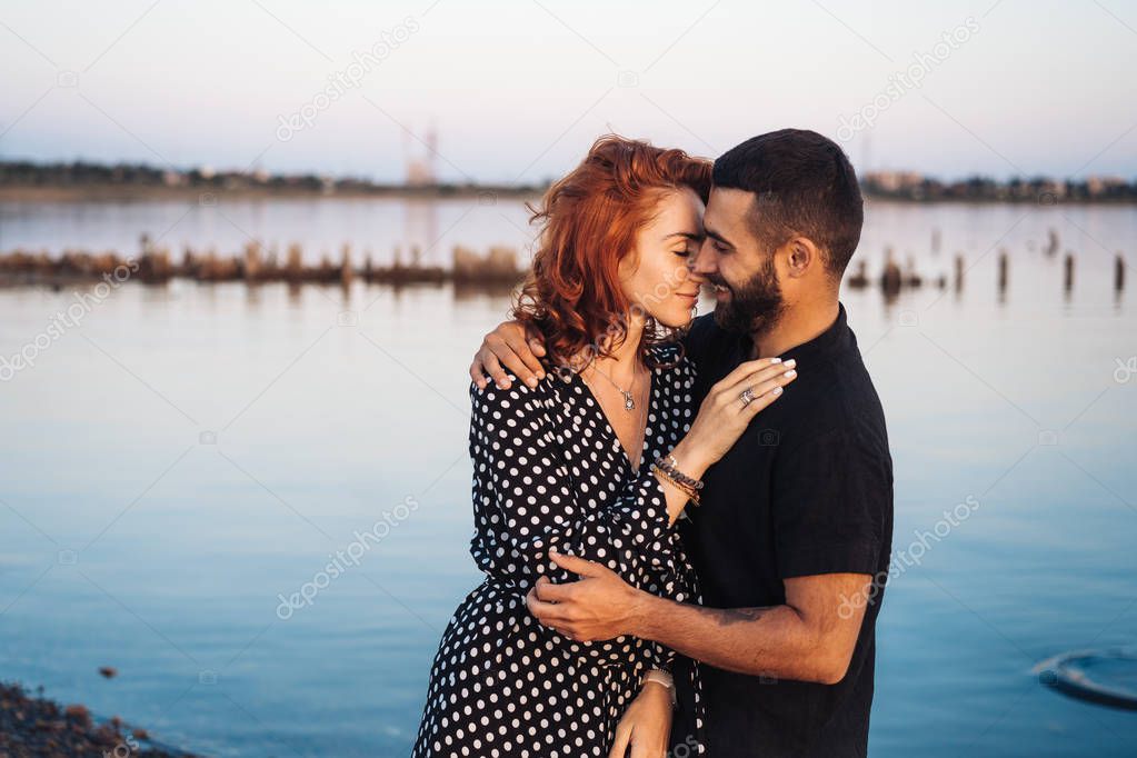 happy young couple posing at the camera