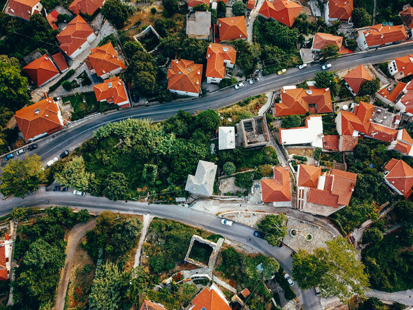 Aerial view of the old european city with red tiled roofs of houses