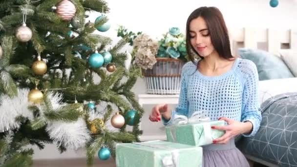 Smiling woman with many gift boxes — Stock Video