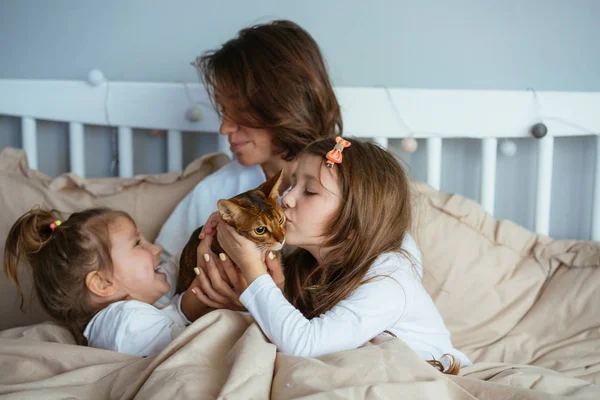 Happy Mother Two Daughters Smiling Hugs Bed Happy Family Home — Stock Photo, Image