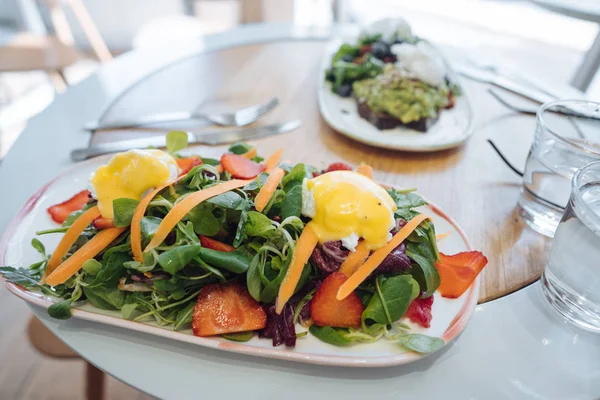 Delicious fresh salad in a rectangular plate on the table — Stock Photo, Image