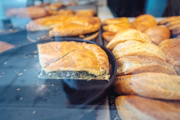 Fresh bakery in showcase of a street shop bakery food.