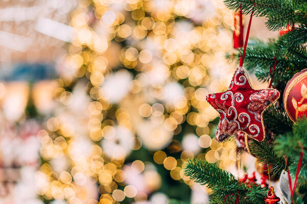 close up view of decorative toys on christmas tree