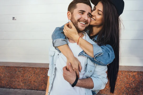 Young beautiful girl hugging her handsome boyfriend — Stock Photo, Image