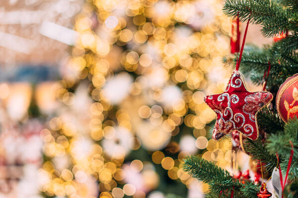 close up view of decorative toys on christmas tree