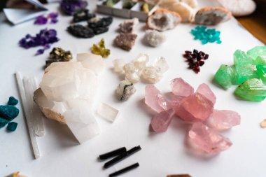 Collection of beautiful precious stones on white table. clipart