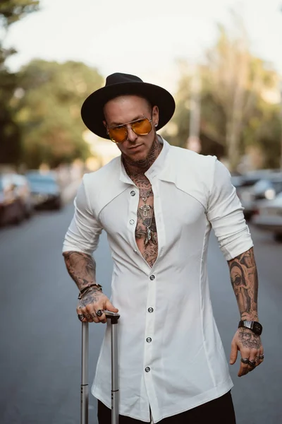 A charismatic young man poses on a camera in the street — Stock Photo, Image