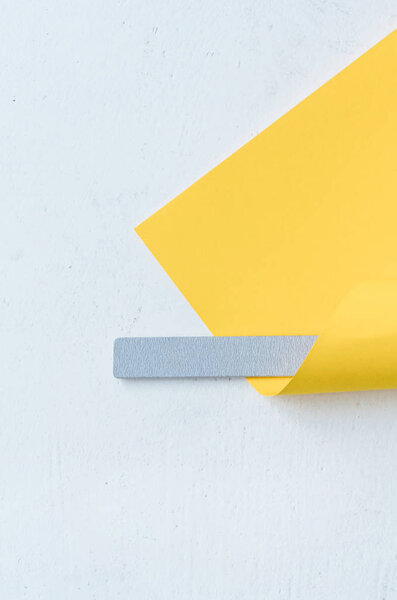 gray nail file wrapped in yellow paper