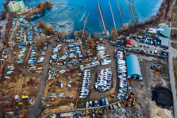 Aerial view of boat yard on land. Stored ships during winter time