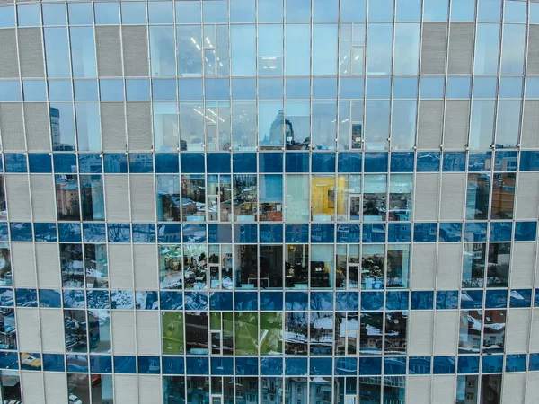 Street reflection on glass steel building facade