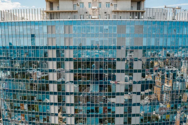 Street reflection on glass steel building facade