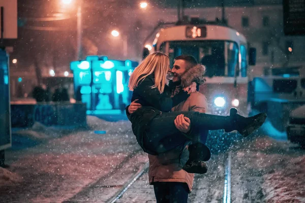 Young adult couple on the snow-covered tram line — Stock Photo, Image