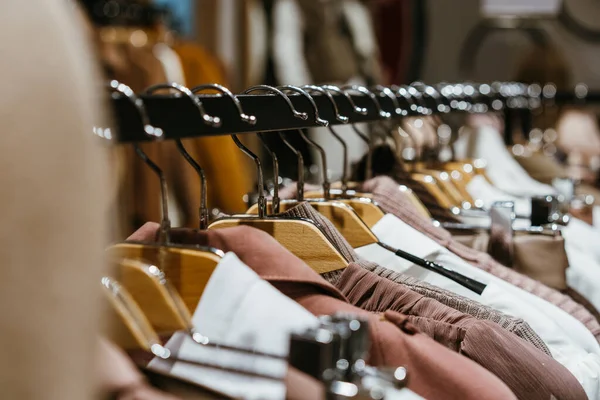 Fashion clothing on hangers at the show — Stock Photo, Image