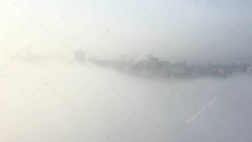 Aerial view of the city in the fog.