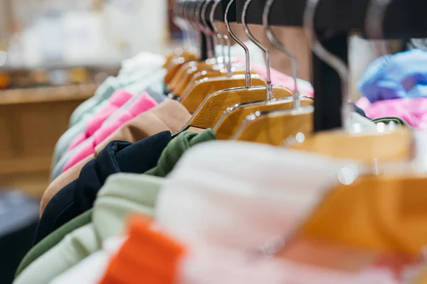 Fashion clothing on hangers at the show — Stock Photo, Image