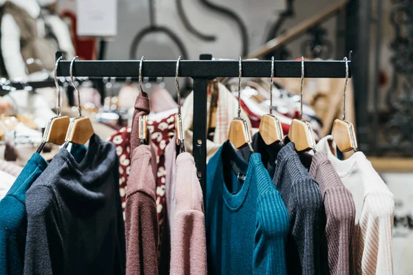 Fashion clothing on hangers at the show — Stock Photo, Image