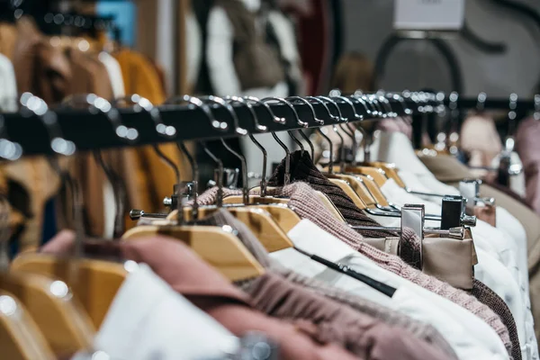 Fashion clothing on hangers at the show — Stock Photo, Image