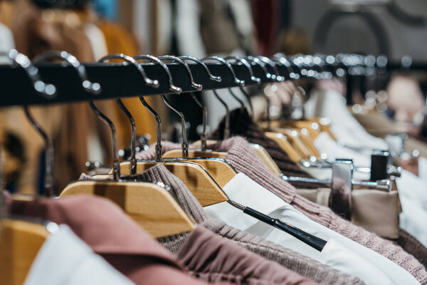 fashion clothing on hangers at the show