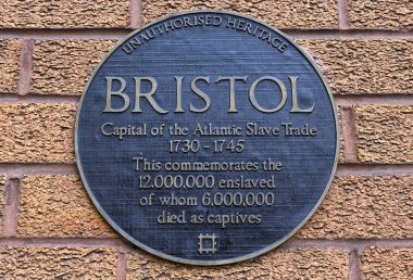 An unofficial plaque by artist Will Coles in Bristol, UK marks the city's involvement in the Atlantic slave trade. clipart