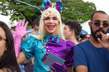 A happy, costumed trans woman at the LGBTQIA+ Pride Parade in the city of Goiania.