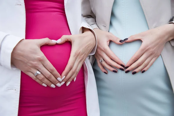 Two Pregnant Girlfriends Holding Belly Hands Heart Shaped Waiting Boy — Stock Photo, Image